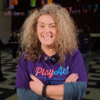 owner of PlayAct Drama School blonde woman Adrienne Lee wearing purple tshirt