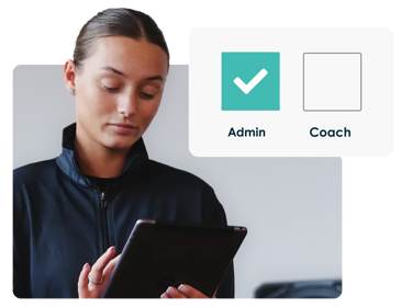 Kid's club coach with a tablet using ClassForKid's class register management software